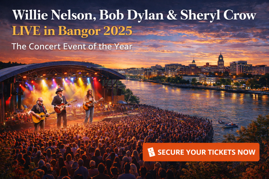 Concert crowd at Maine Savings Amphitheater in Bangor Maine at sunset with Willie Nelson, Bob Dylan and Sheryl Crow performing on the waterfront stage along the Penobscot River.