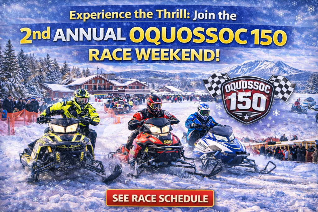 Snowmobile racers speeding through a snow-covered forest near Oquossoc, Maine during the Oquossoc 150 winter race weekend with mountains in the background.